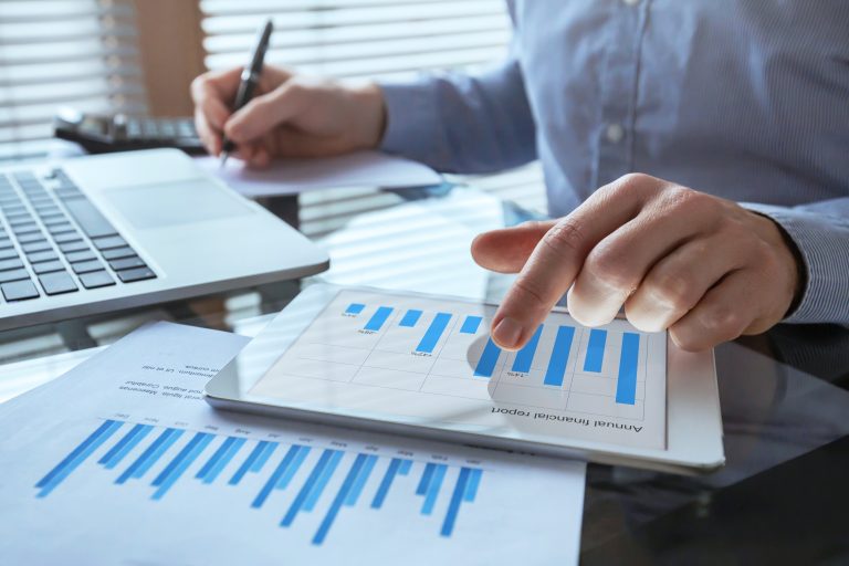 Businessman Working With Financial Report Charts, Business Analytics And Kpi